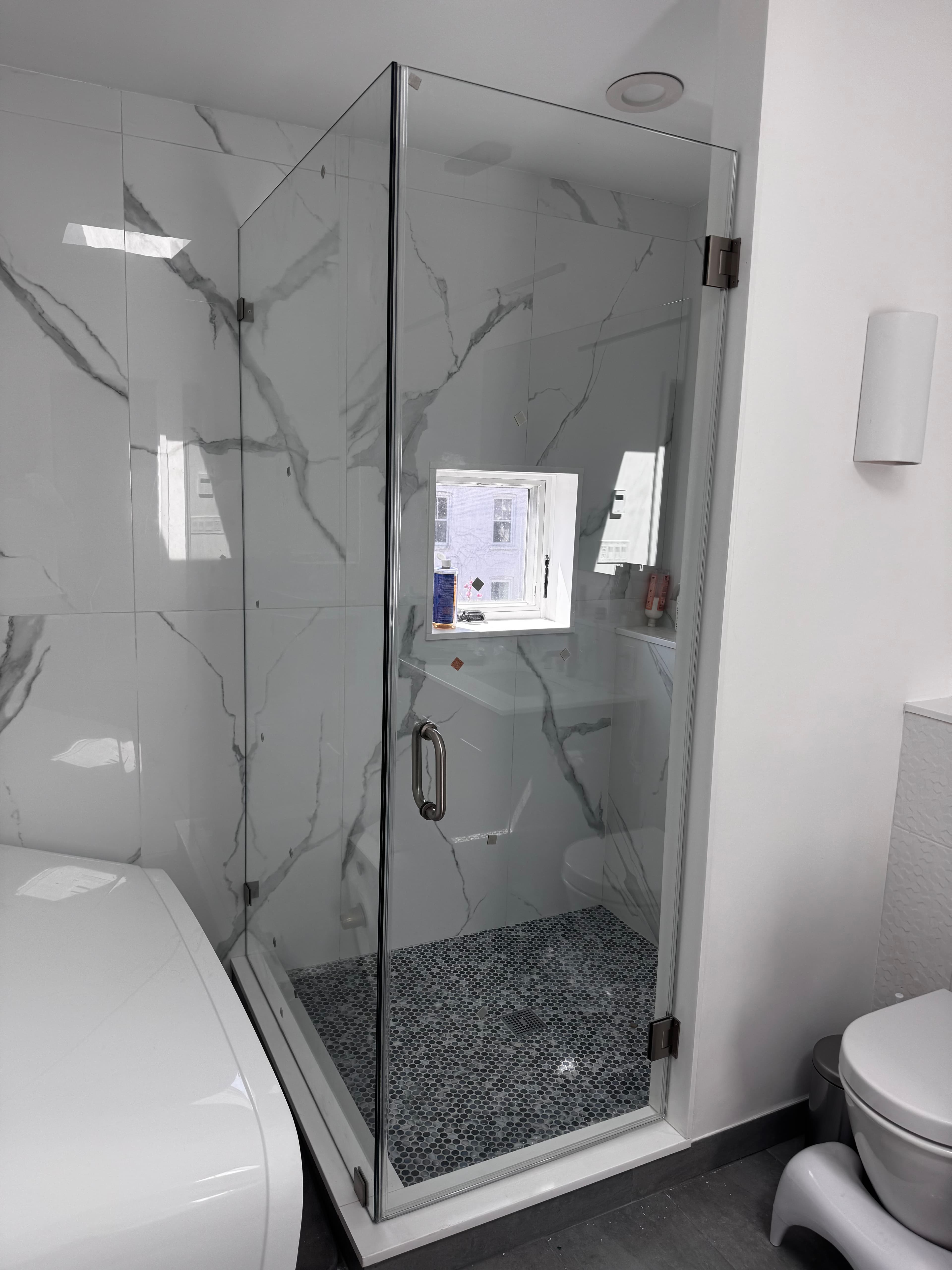 Corner Swing Door shower door installation in Brooklyn